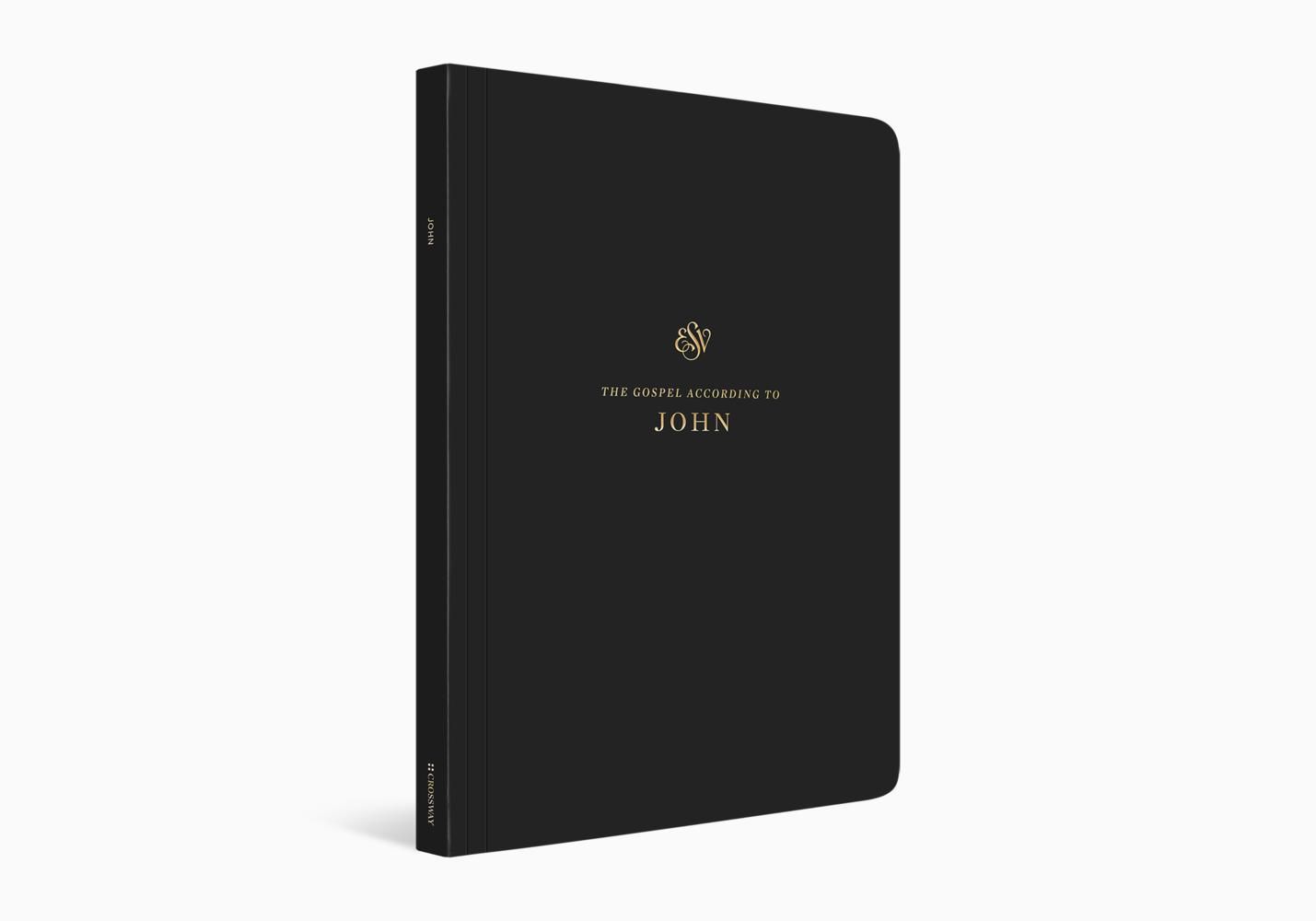 A black book with a gold logo on the cover is sitting on a white surface.