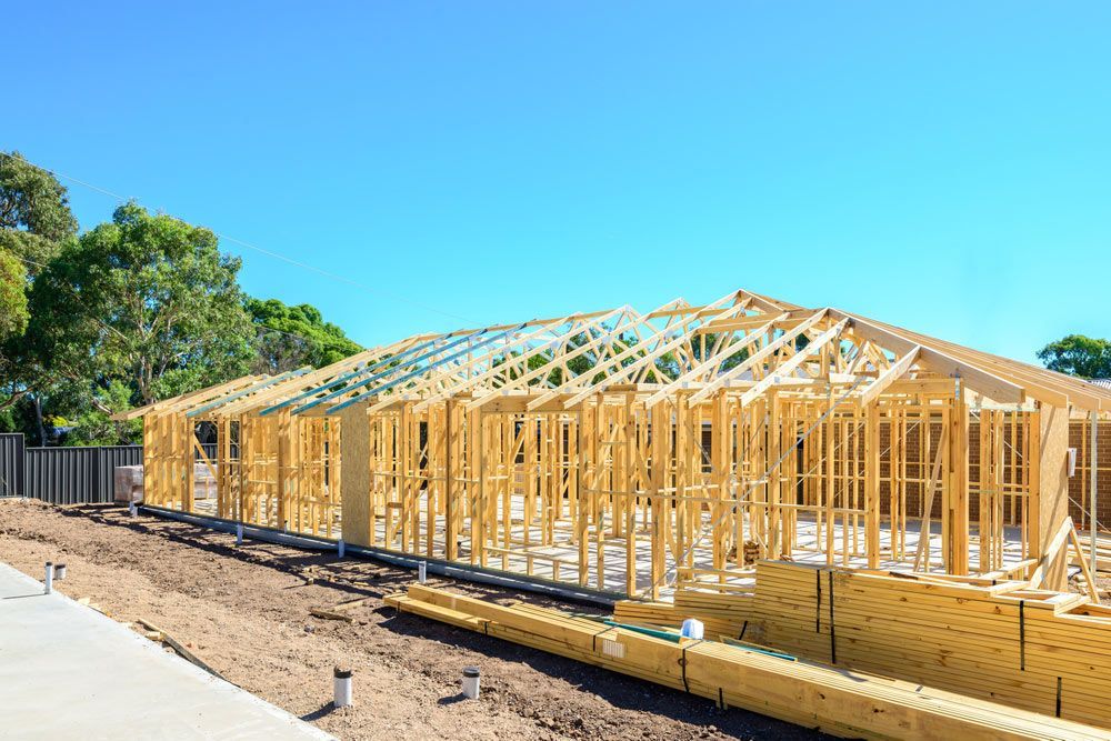 New Australian House Timber Frame Installation Process At Construction Site — Trussted Frames & Trusses in Taree, NSW