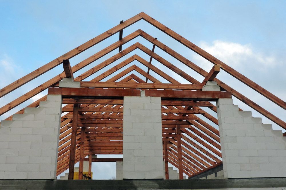 A Timber Roof Truss In A House That Is Under Construction — Trussted Frames & Trusses in Warners Bay, NSW