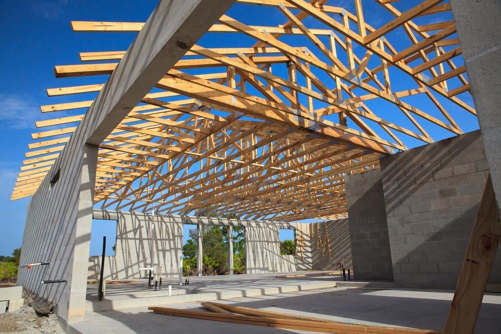 New Home Construction Of A Cement Block Home With Wooden Roof Trusses — Trussted Frames & Trusses in Singleton, NSW