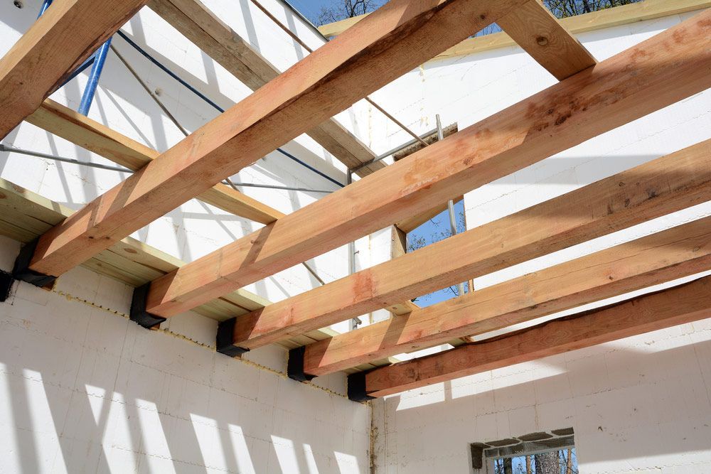 Wooden Beams At Construction The Roof Truss System Of The House — Trussted Frames & Trusses in Warners Bay, NSW