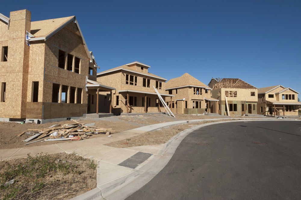 A Row Of Timber Houses Are Being Built In A Residential Area— Trussted Frames & Trusses in Forster, NSW