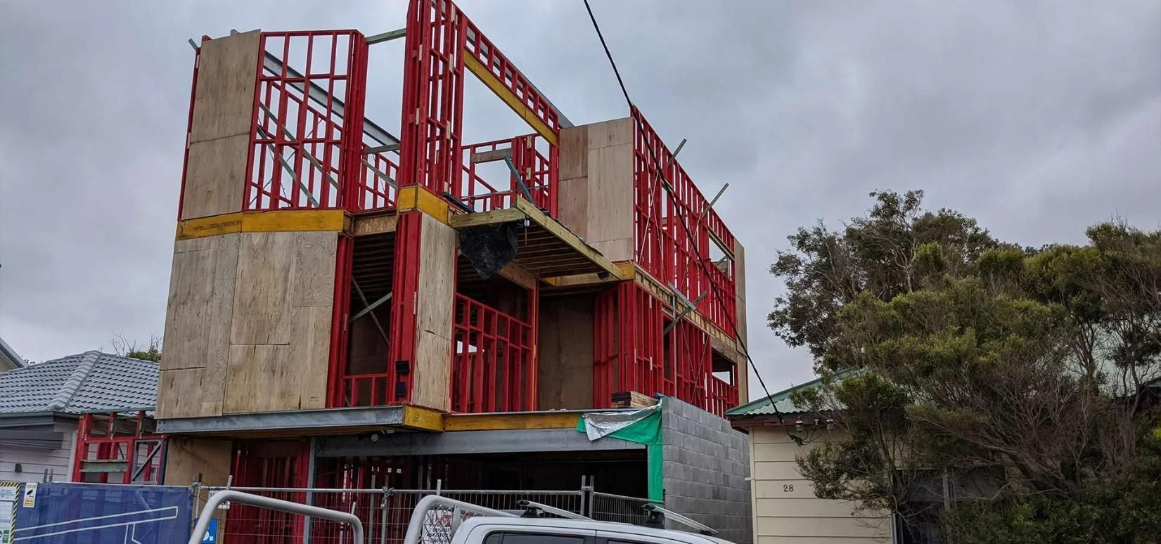 A Building Is Being Built with A Truck Parked in Front of It — Trussted Frames & Trusses in Bennetts Green, NSW