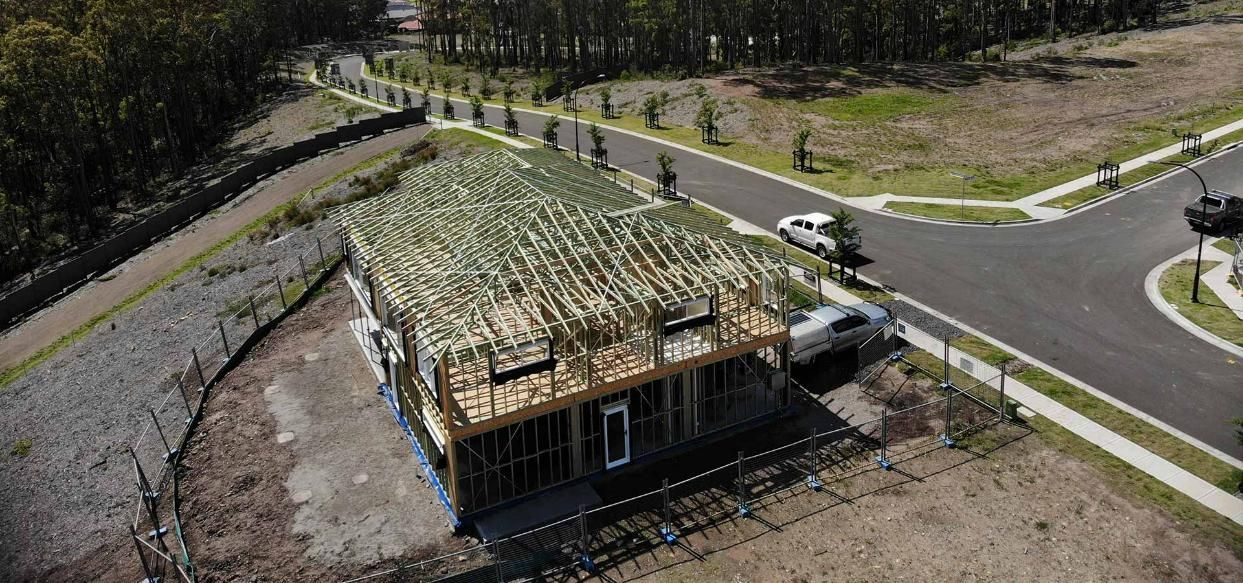 An Aerial View of A House Under Construction in A Residential Area — Trussted Frames Trusses in Bennetts Green, NSW