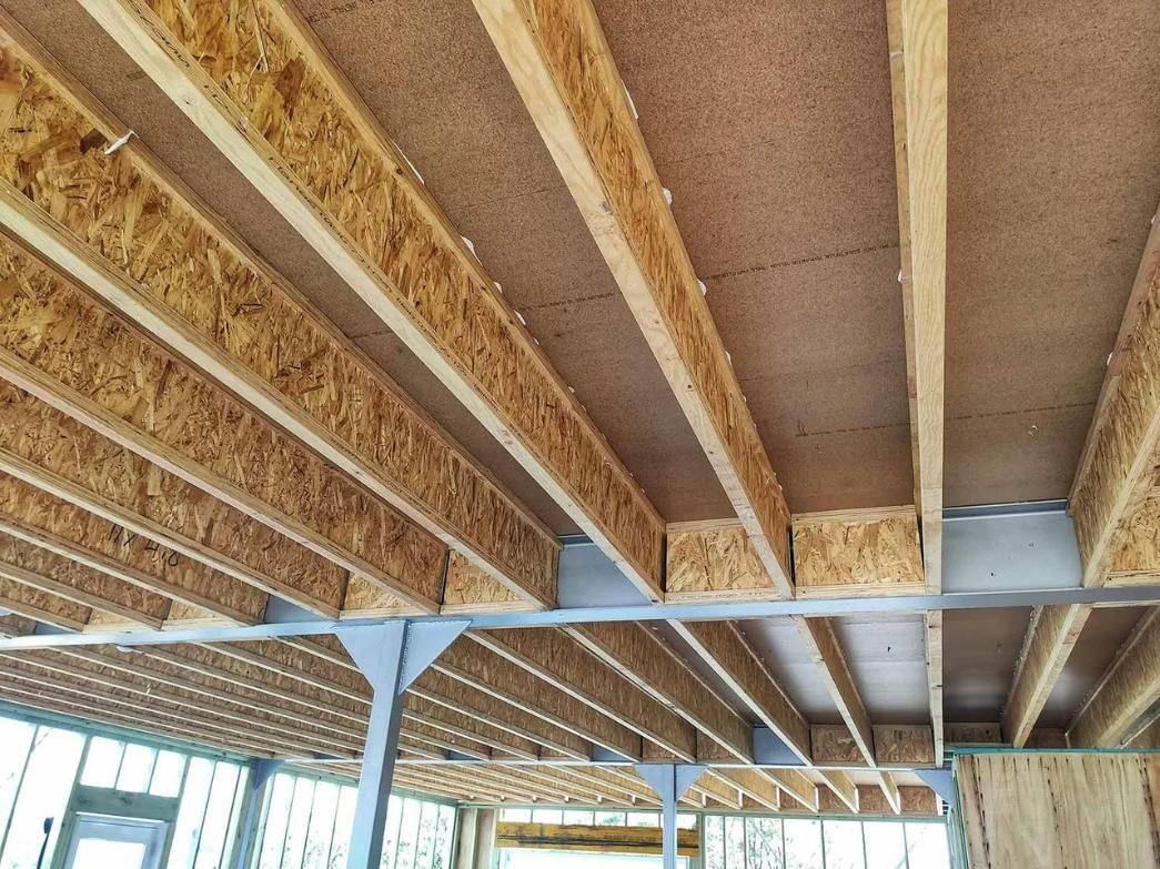 The Ceiling of A Building Is Made of Wooden Beams — Trussted Frames & Trusses in Bennetts Green, NSW