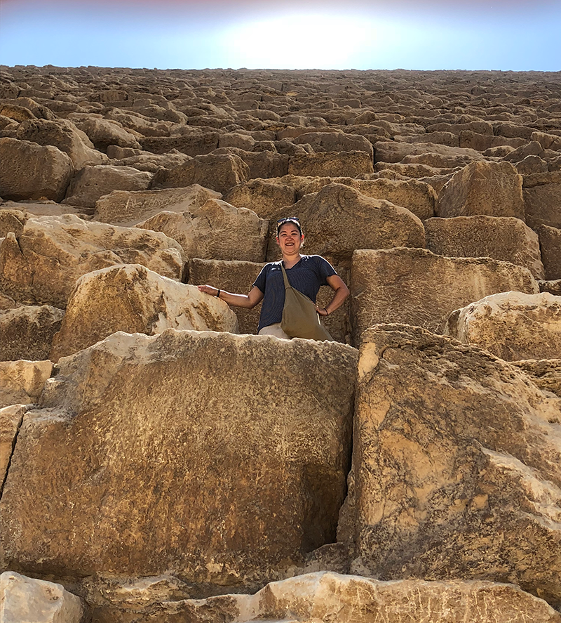 Felicia standing on top of a pile of rocks.