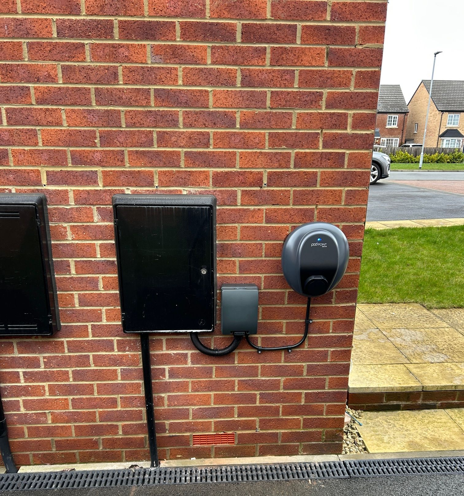 A person is opening a car door with a key.