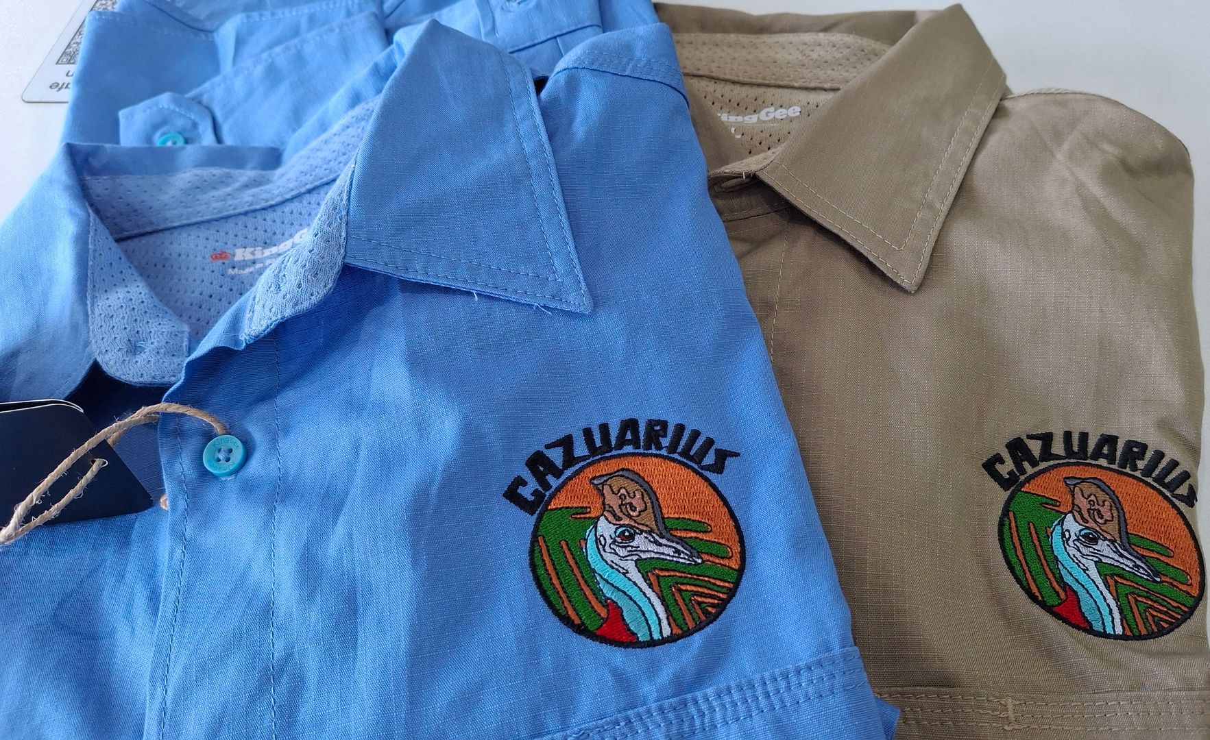 A Close Up of Two Work Shirts With Personalised Embroidery — NMTG Embroidery In Wollongong, NSW
