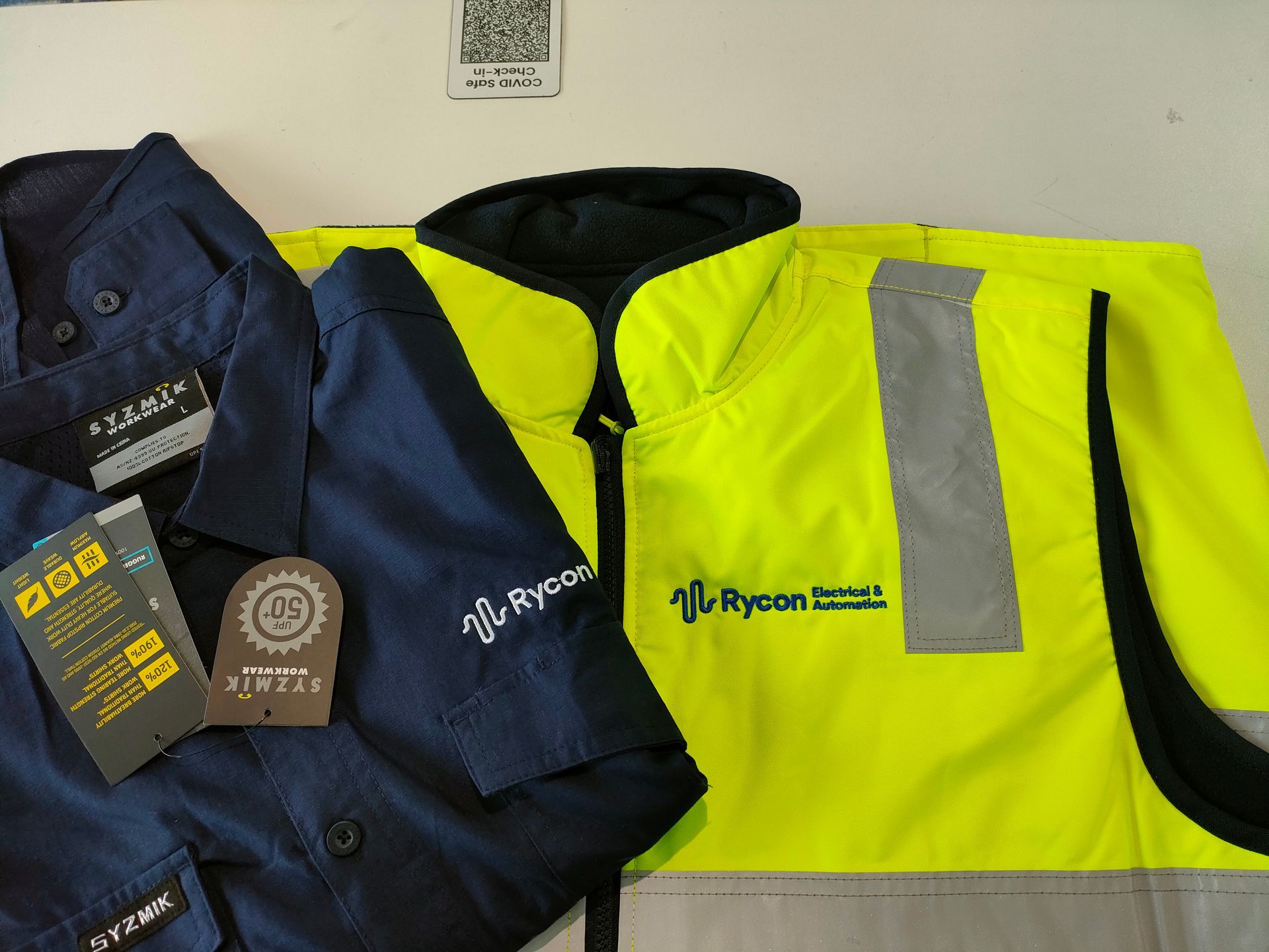A Hi Vis Jacket With Blue Button Up Shirt — NMTG Embroidery In Wollongong, NSW