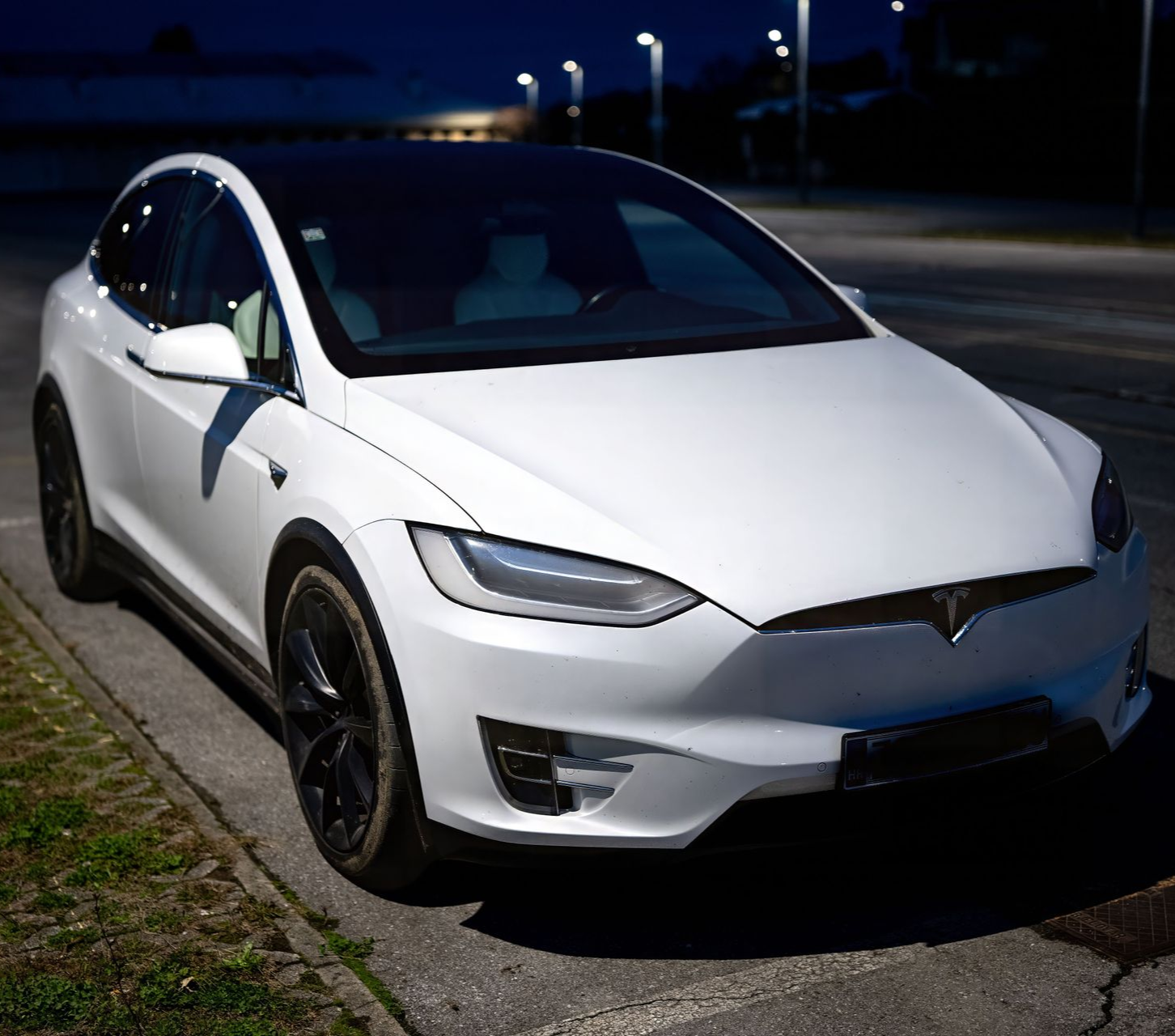 A white Tesla EV