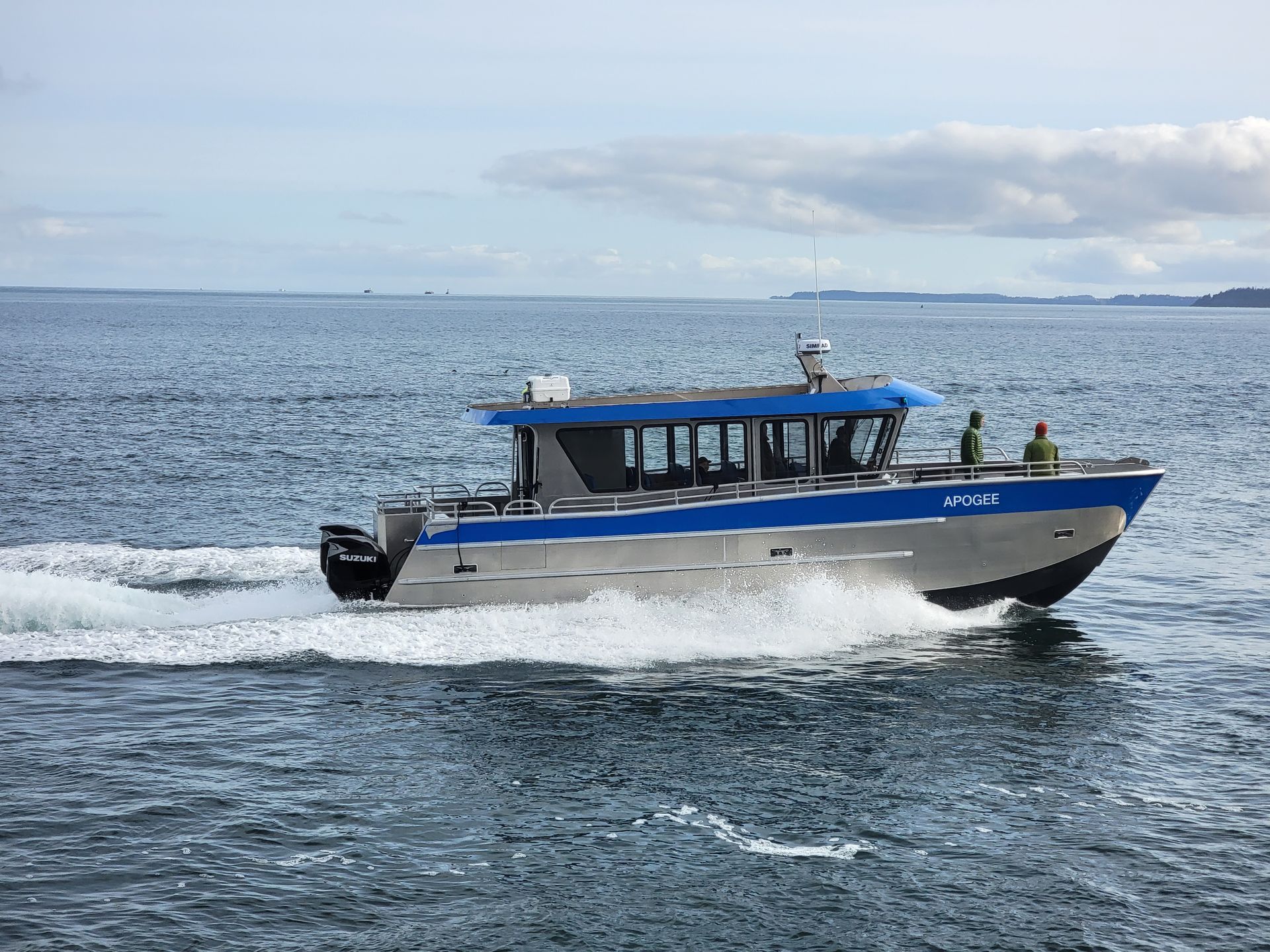 40 foot catamaran whale watching boat underway.