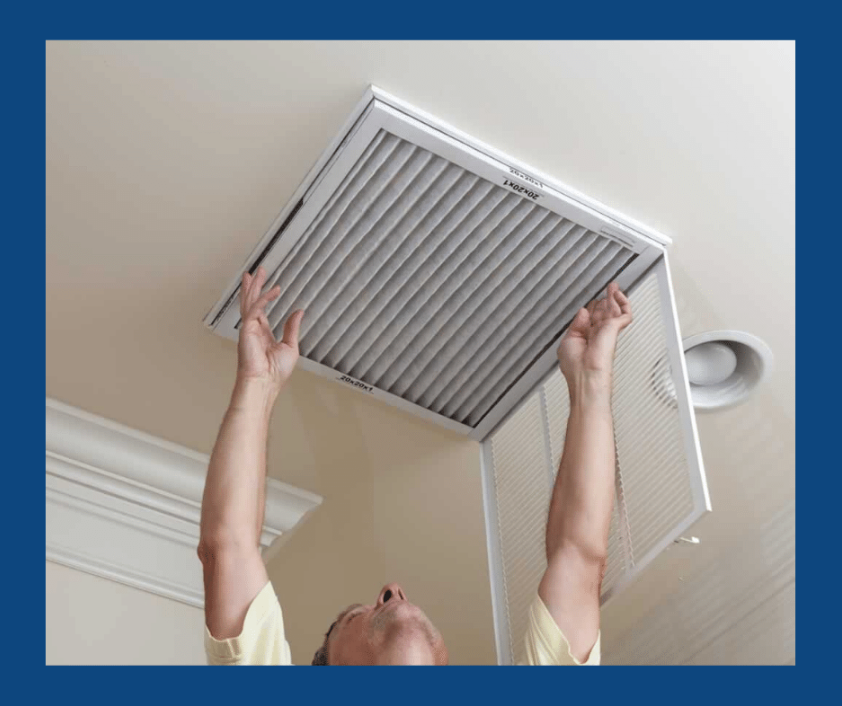 Man replacing a dirty air filter on an ac unit