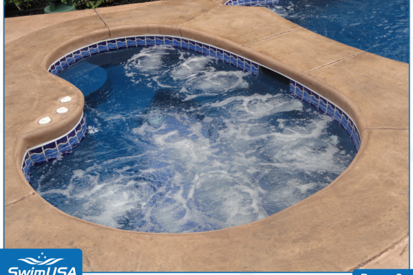 Small round swimming pool with blue water and tan deck, viewed from above
