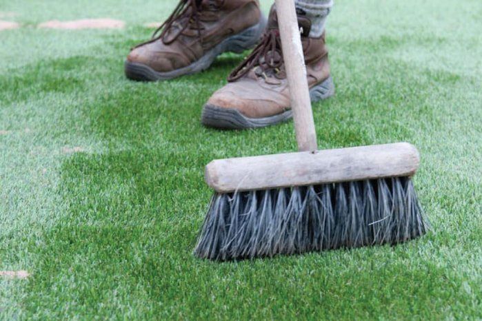 Zest Artificial Grass Grantham - artificial turf having leaves swept up