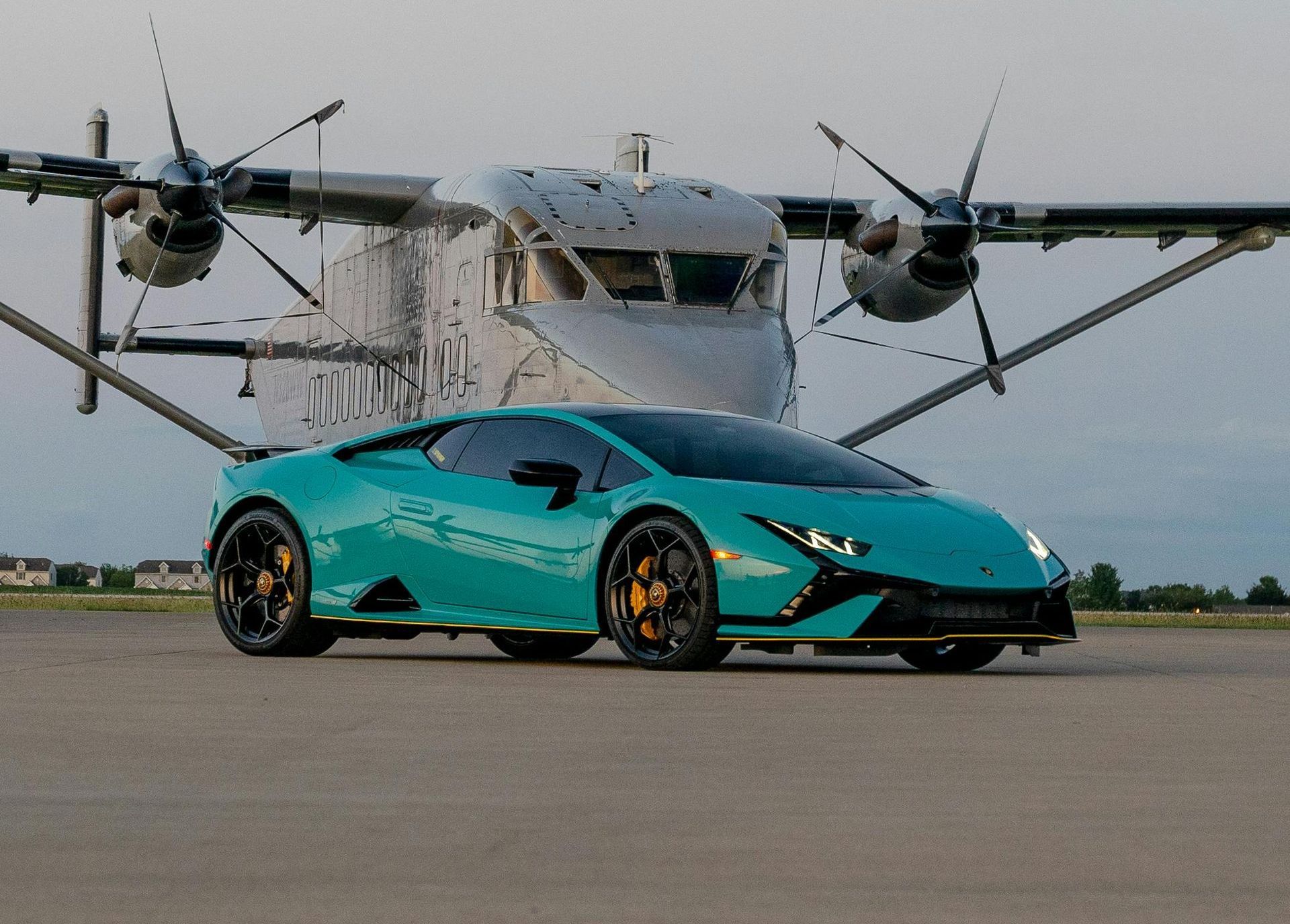 A purple Lamborghini is parked on a race track