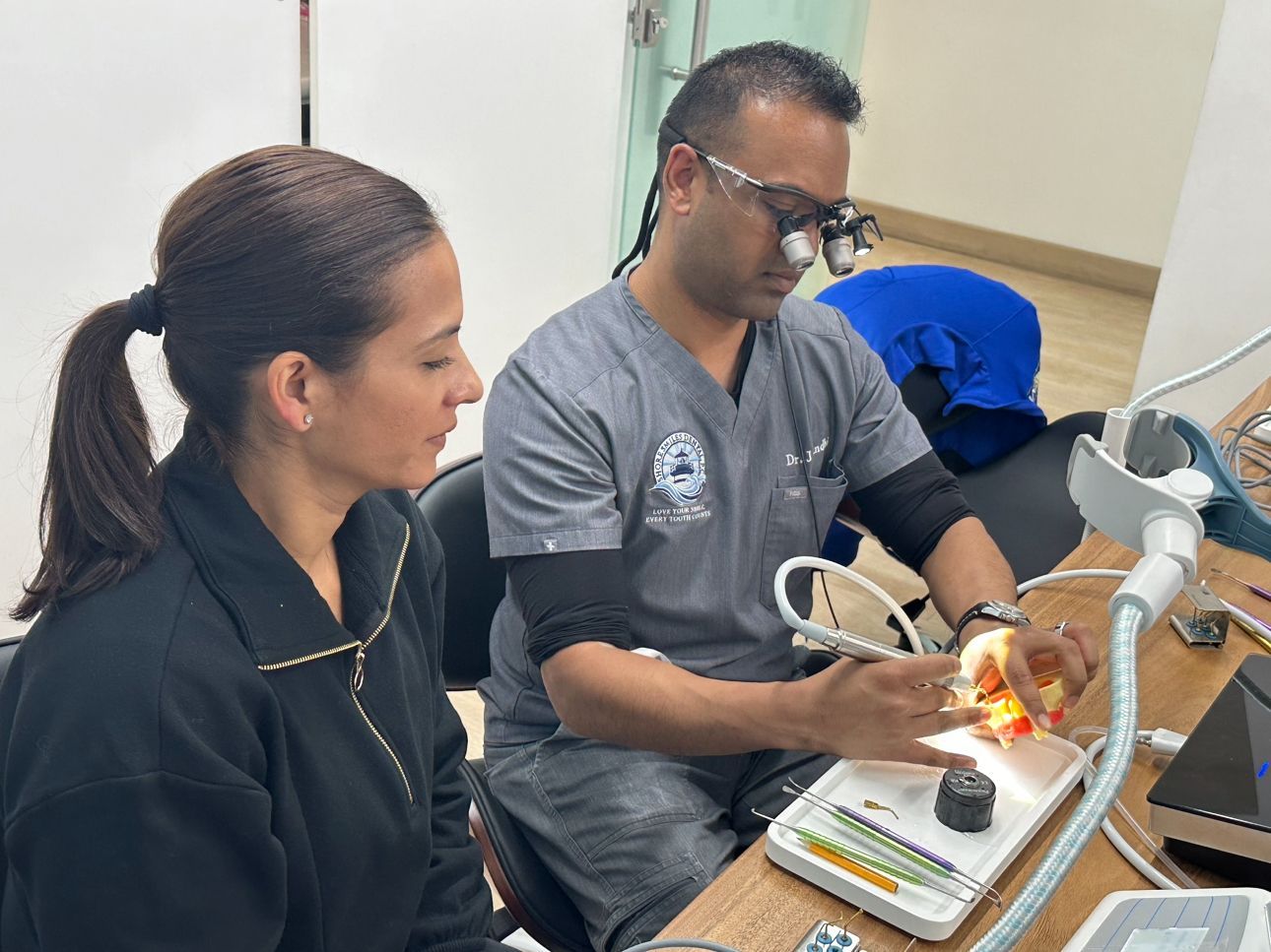 Dr. Gandhi in lab with lab technician