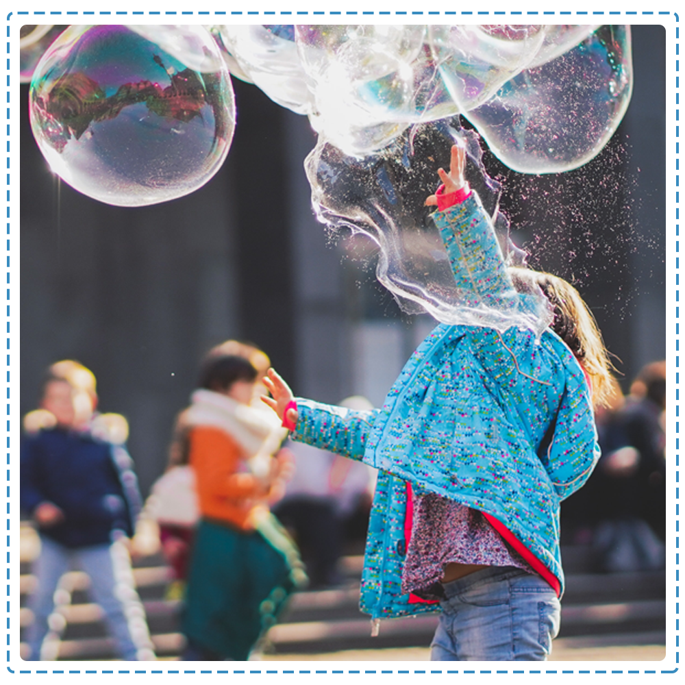 Girl playing bubbles