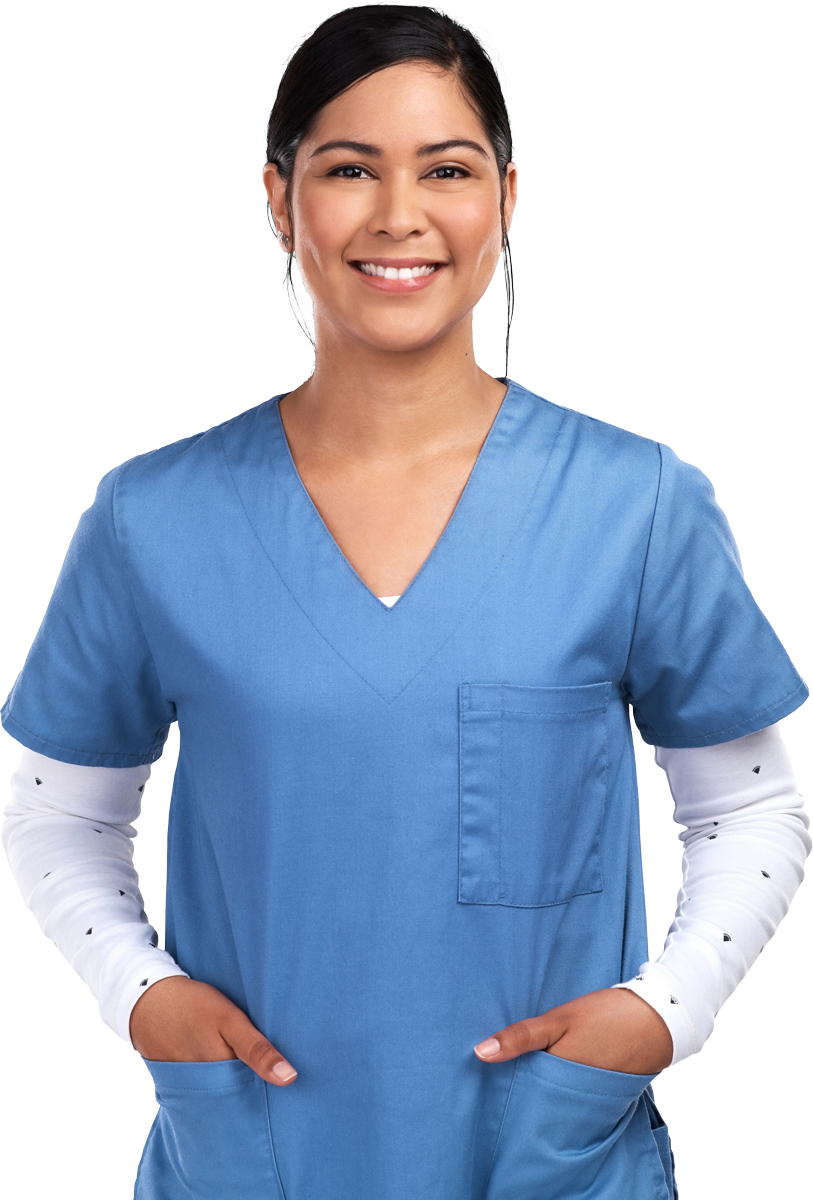 Woman in blue scrubs smiles, hands in pockets. Woman in blue scrubs smiles, hands in pockets.