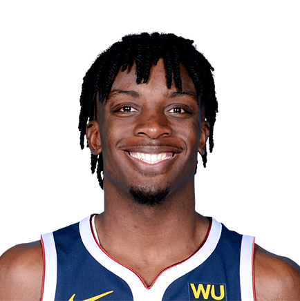 Basketball player in a Nuggets jersey smiling, headshot.