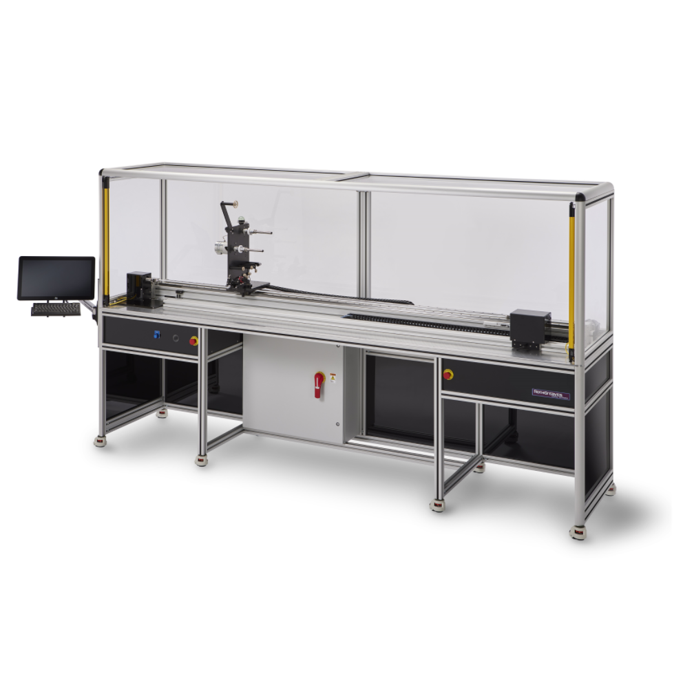 Industrial machine workstation with enclosed frame and touchscreen control panel on a black-and-silver table