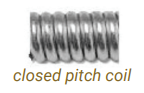 Close-up of a metal closed-pitch coil spring with the label “closed pitch coil”