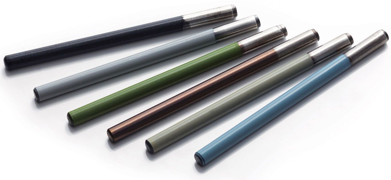 Five sleek pens in black, green, brown, gray, and blue, arranged diagonally on a white background