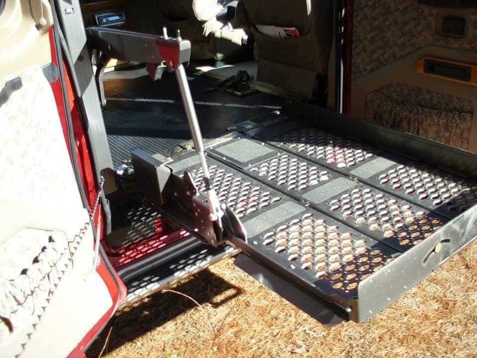 A wheelchair ramp in the back of a van