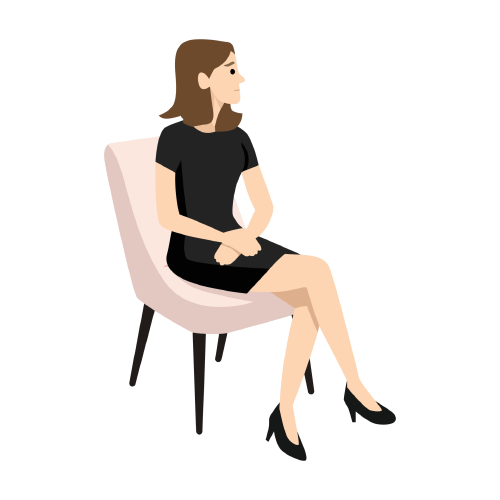 Woman in a black dress seated on a light pink chair against a white background