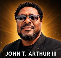 Portrait of John T. Arthur III wearing sunglasses and a black blazer on a gold background