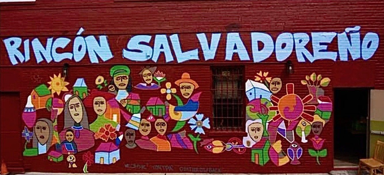 A mural on a red wall that says rincon salvadoreno