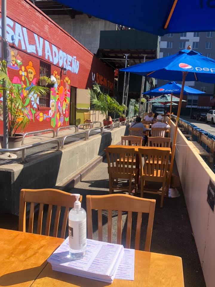 A table with a bottle of hand sanitizer on it