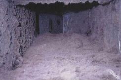 A dirty air vent with a lot of dust coming out of it.