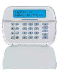 A white keypad with a blue screen that says `` system is ready to arm ''.