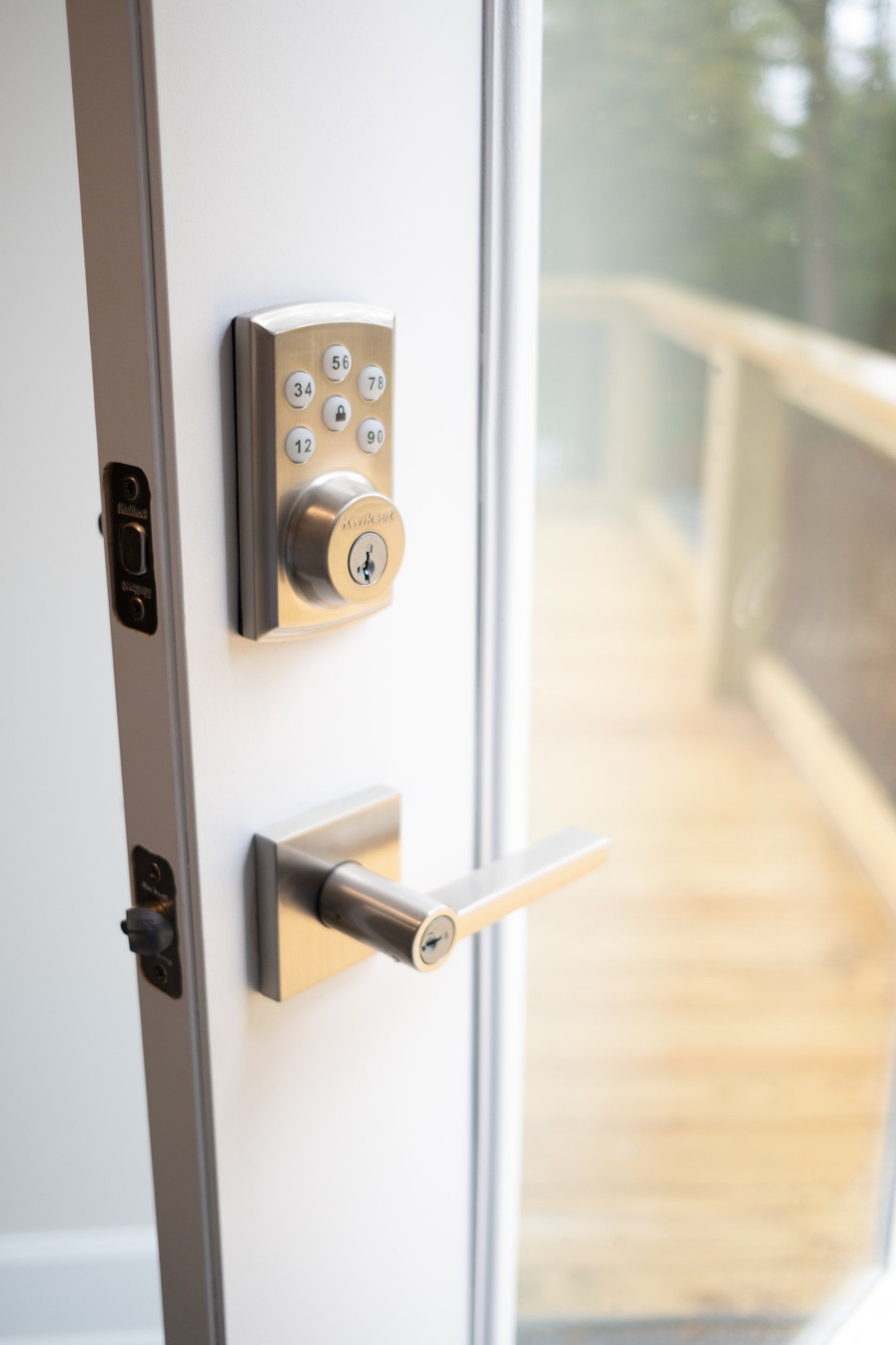 A close up of a door with a digital lock on it.