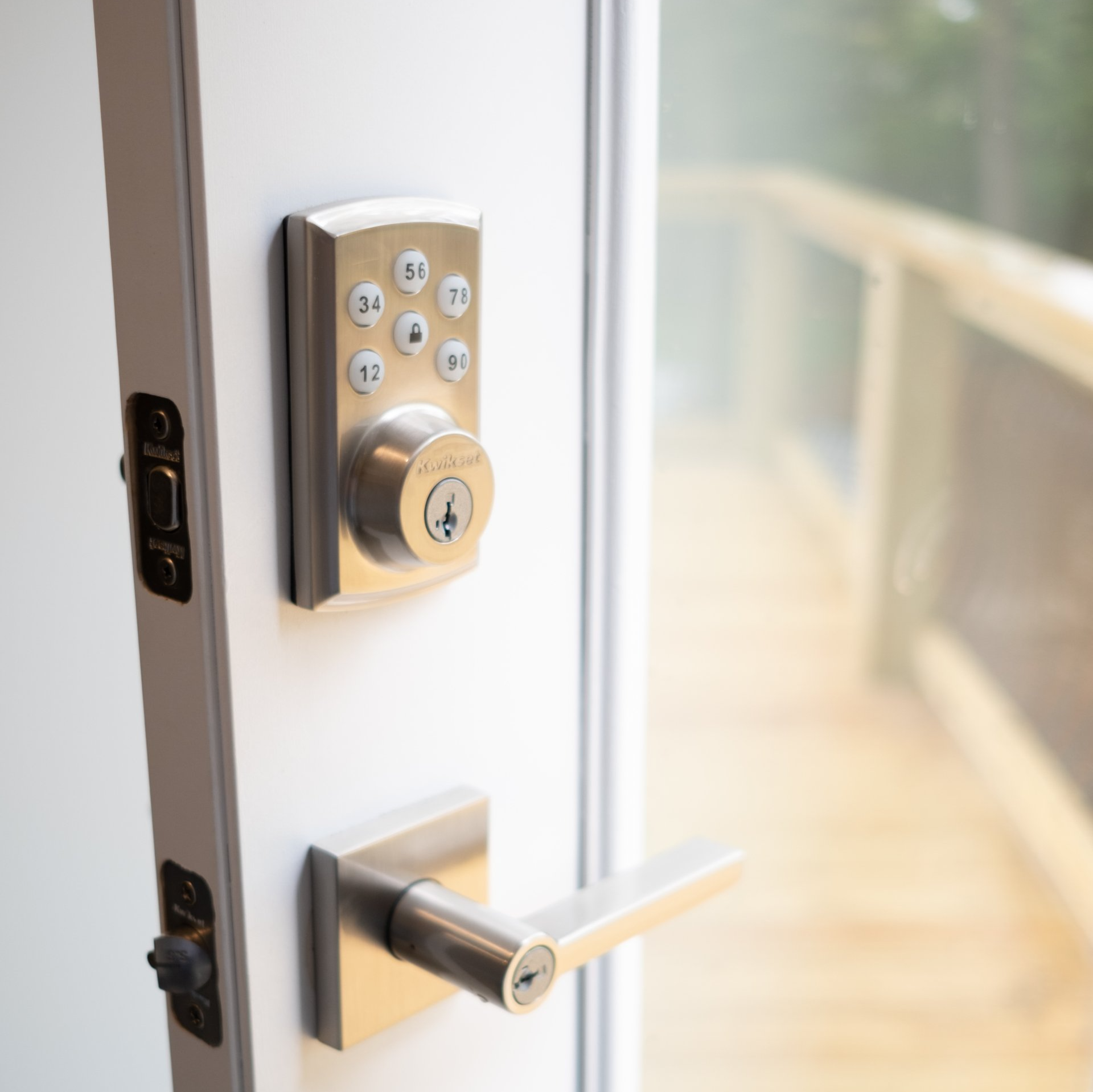 A close up of a door with a keypad on it