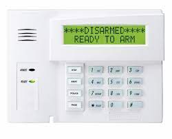 A white alarm system with a green screen that says `` disarmed '' ready to arm.