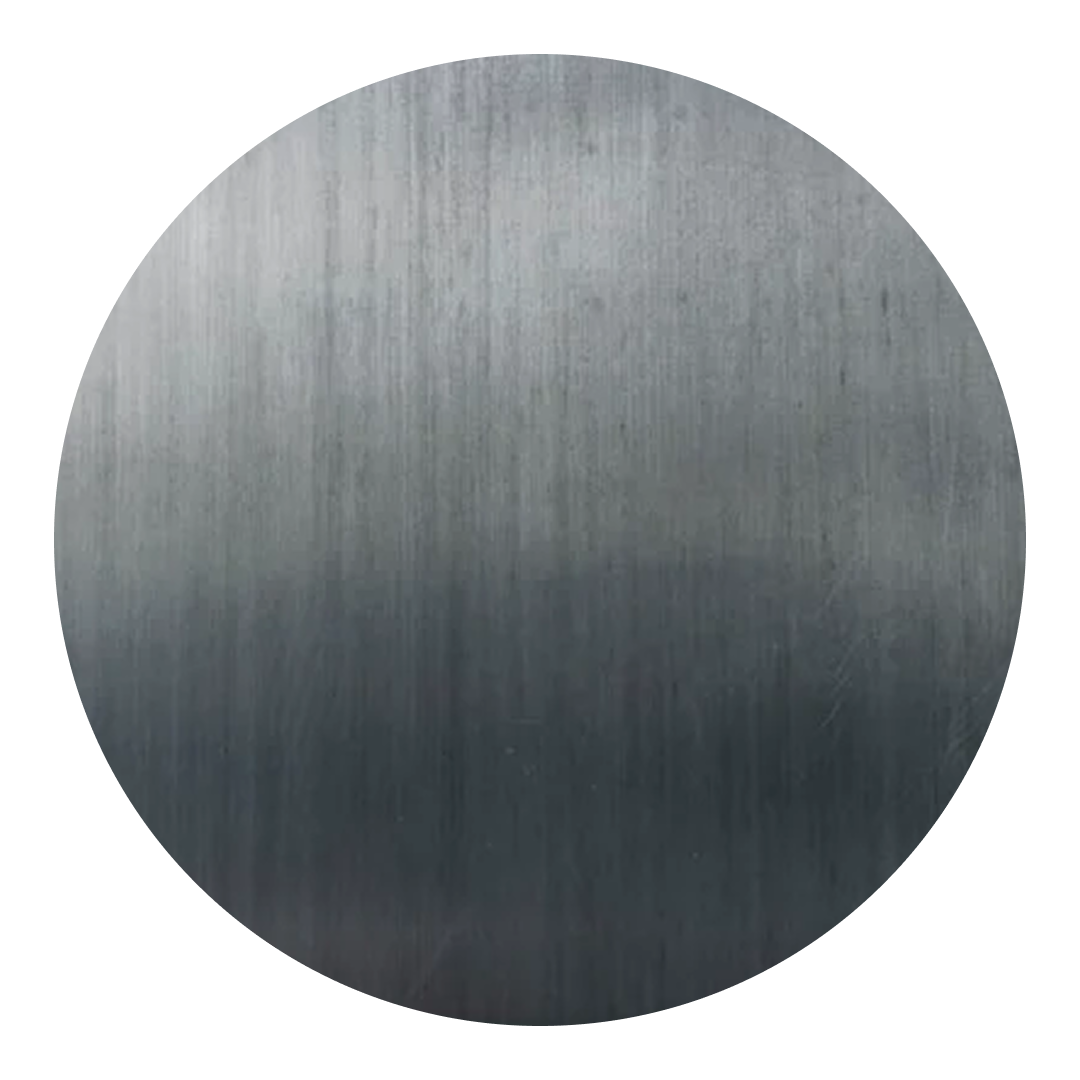 A close up of a dark metal circle on a white background