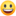 A blurry picture of a smiley face on a white background.