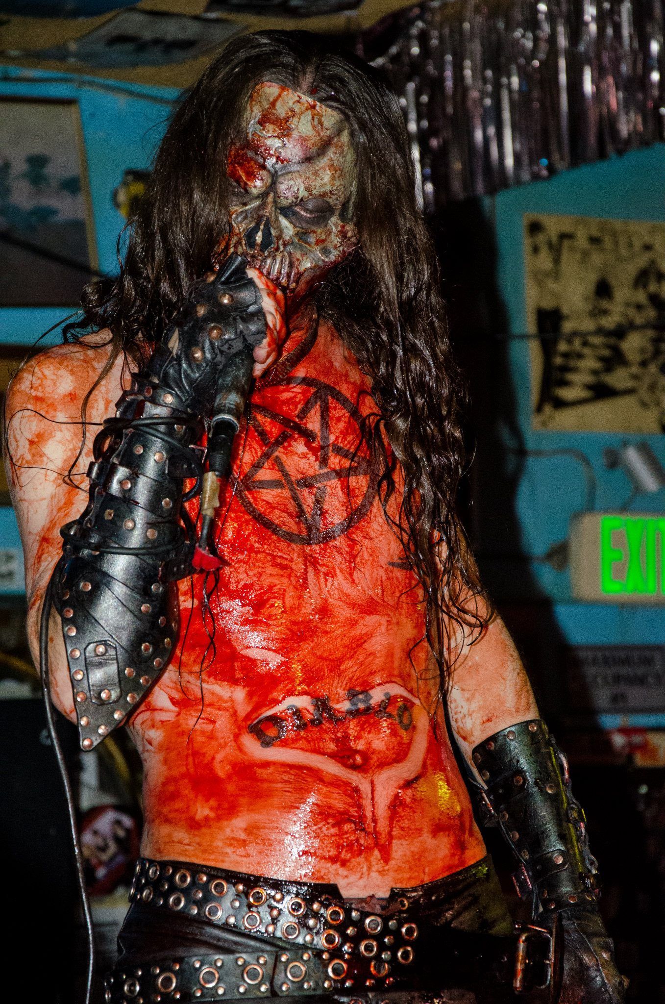 A band with a skull and crossbones logo on their shirt