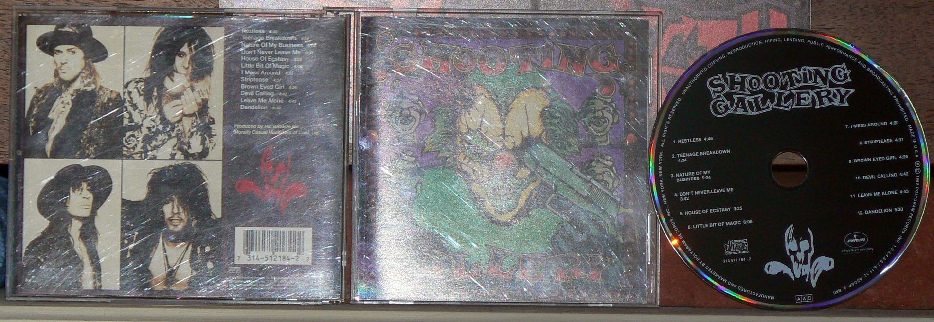 A cd with a picture of a group of people on it