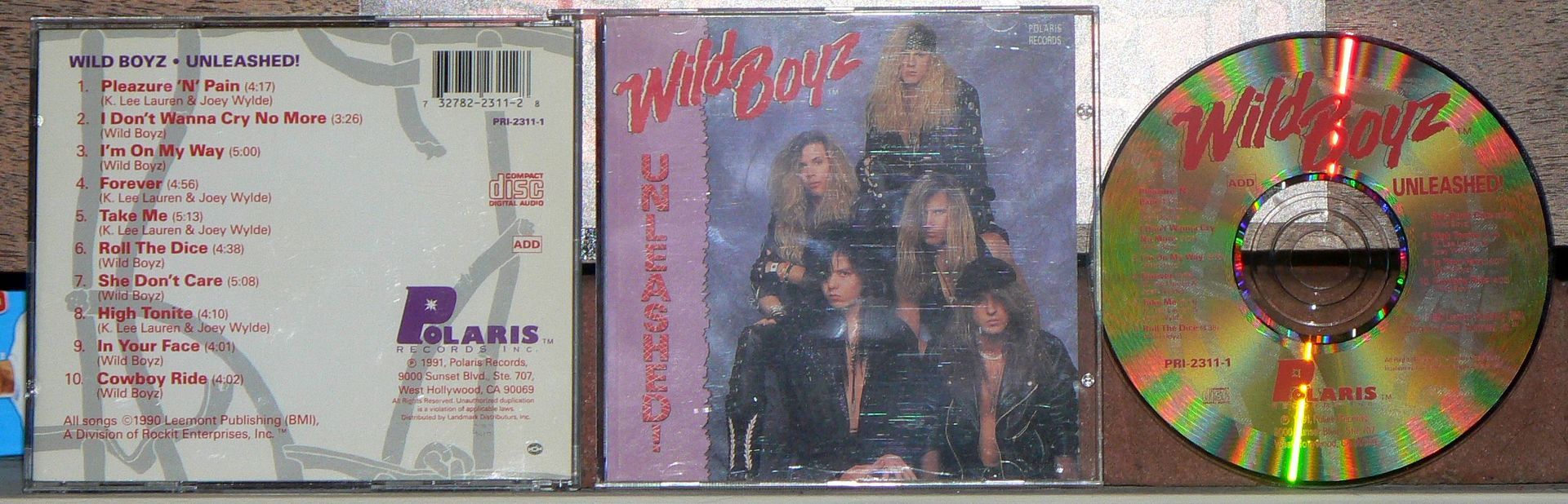 A cd with a picture of a group of people on it