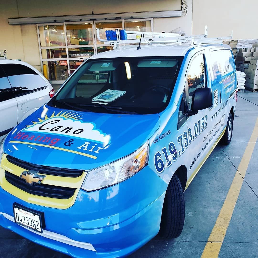 Blue and yellow Chevrolet van with 