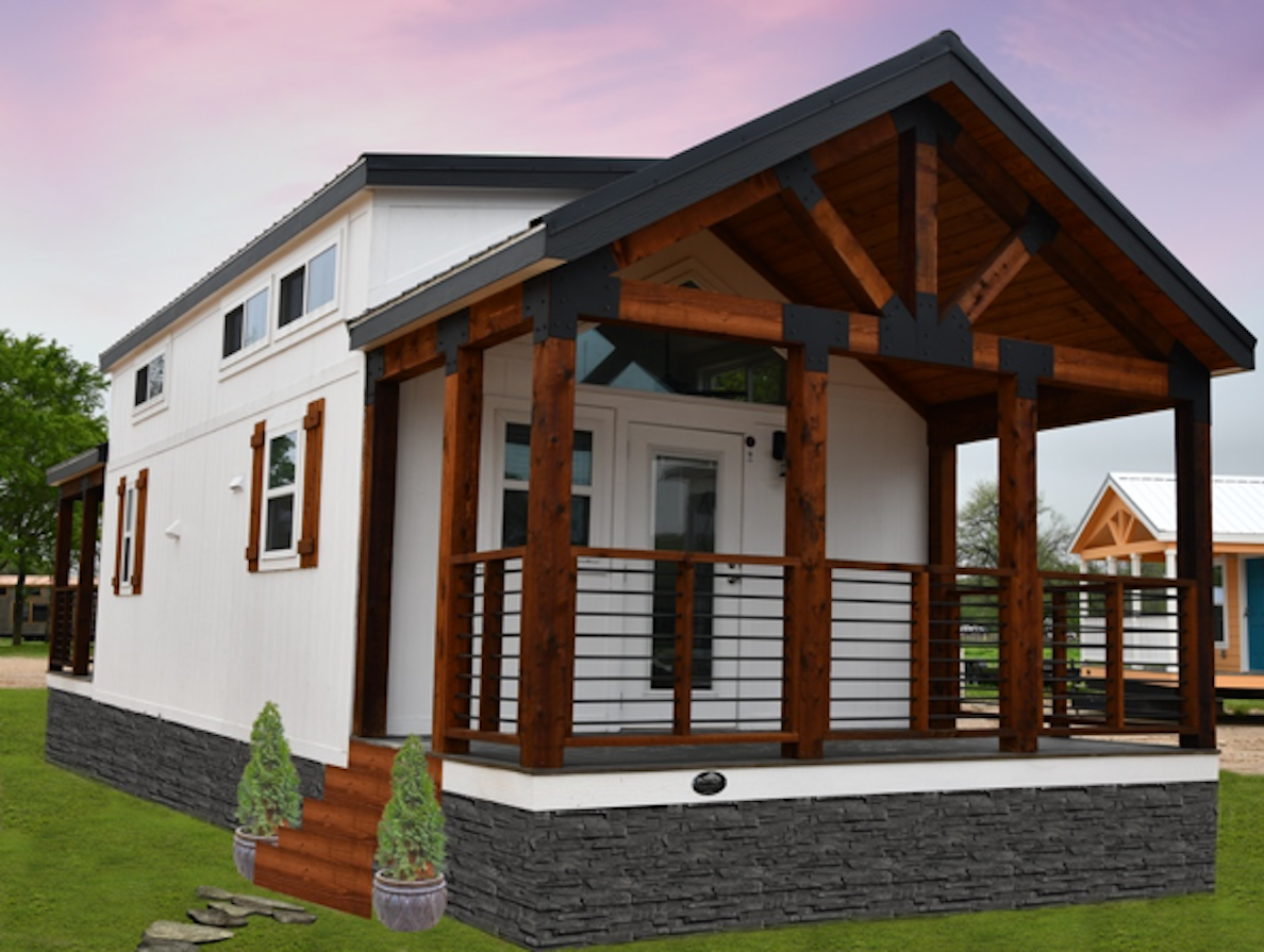 A white house with a wooden porch and stairs