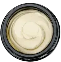 Top-down view of a bowl of creamy white sauce or batter with a spiral swirl