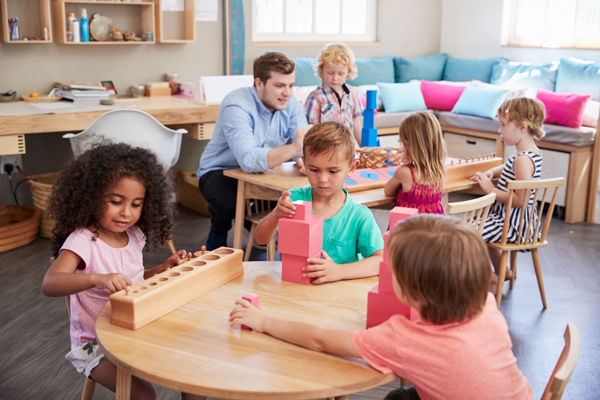 Montessori children working in the classroom 