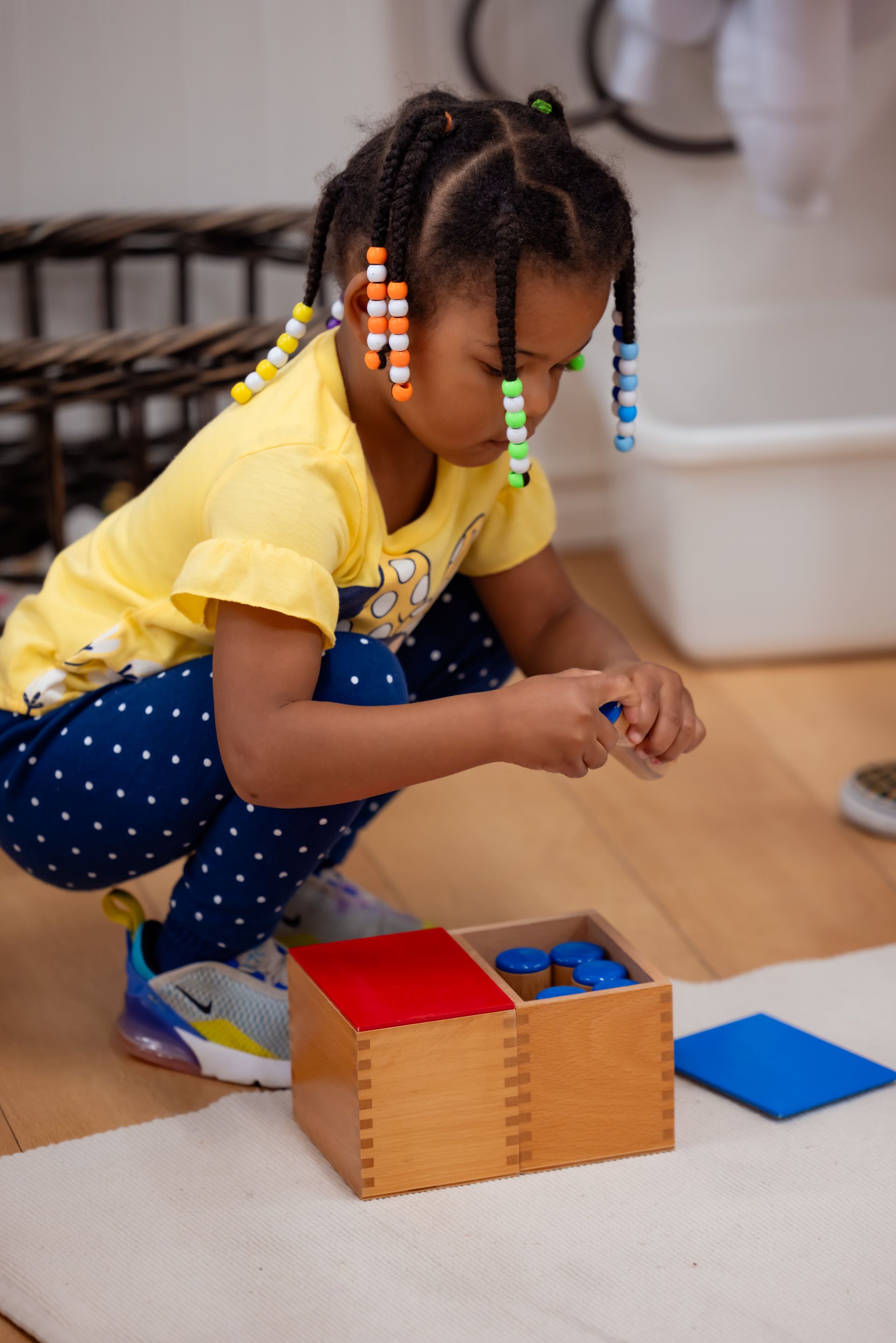 Montessori child working with math materials