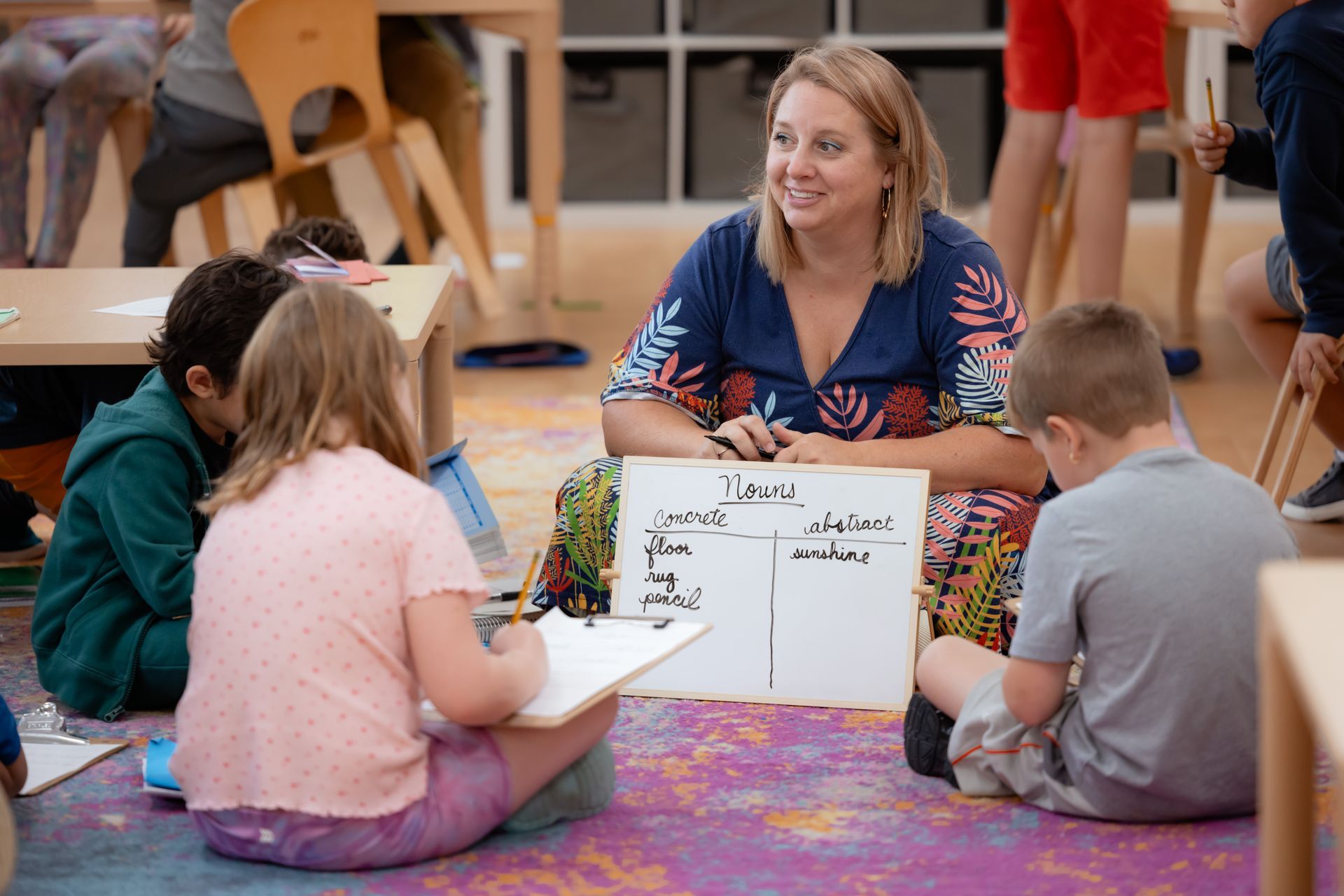 Montessori guide and children in the classroom 