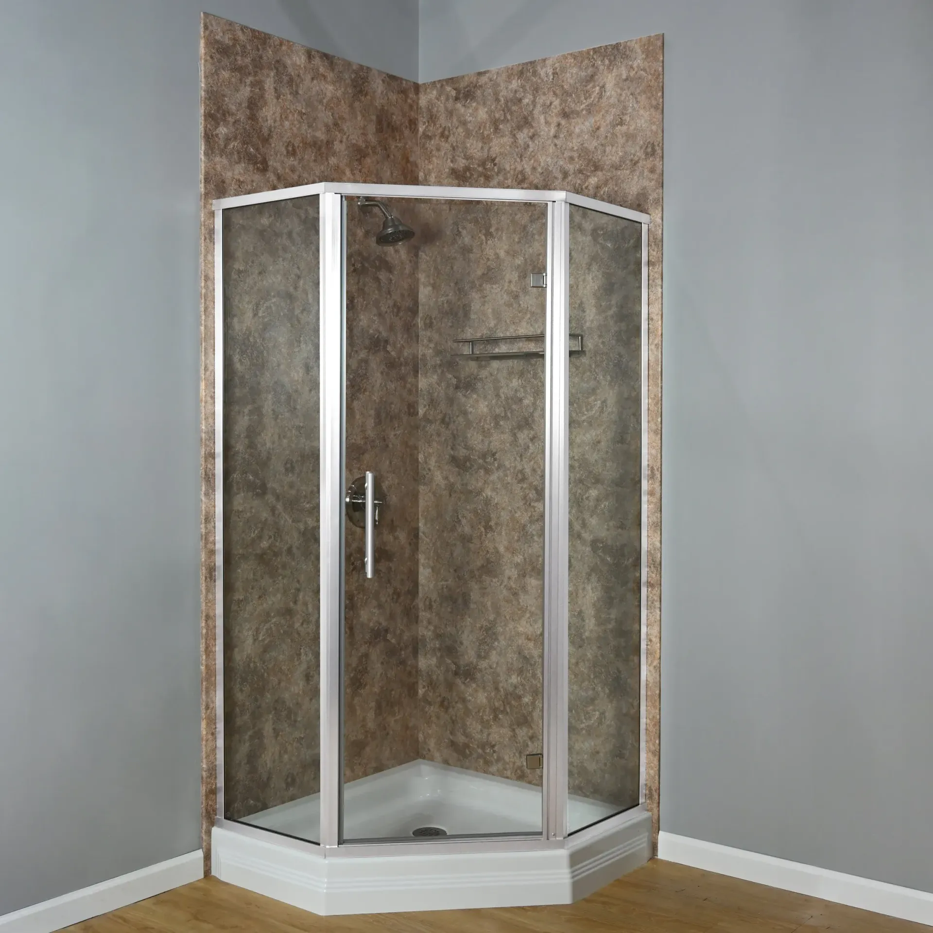 Corner shower stall with glass doors, white frame, and beige tile walls in a bathroom.