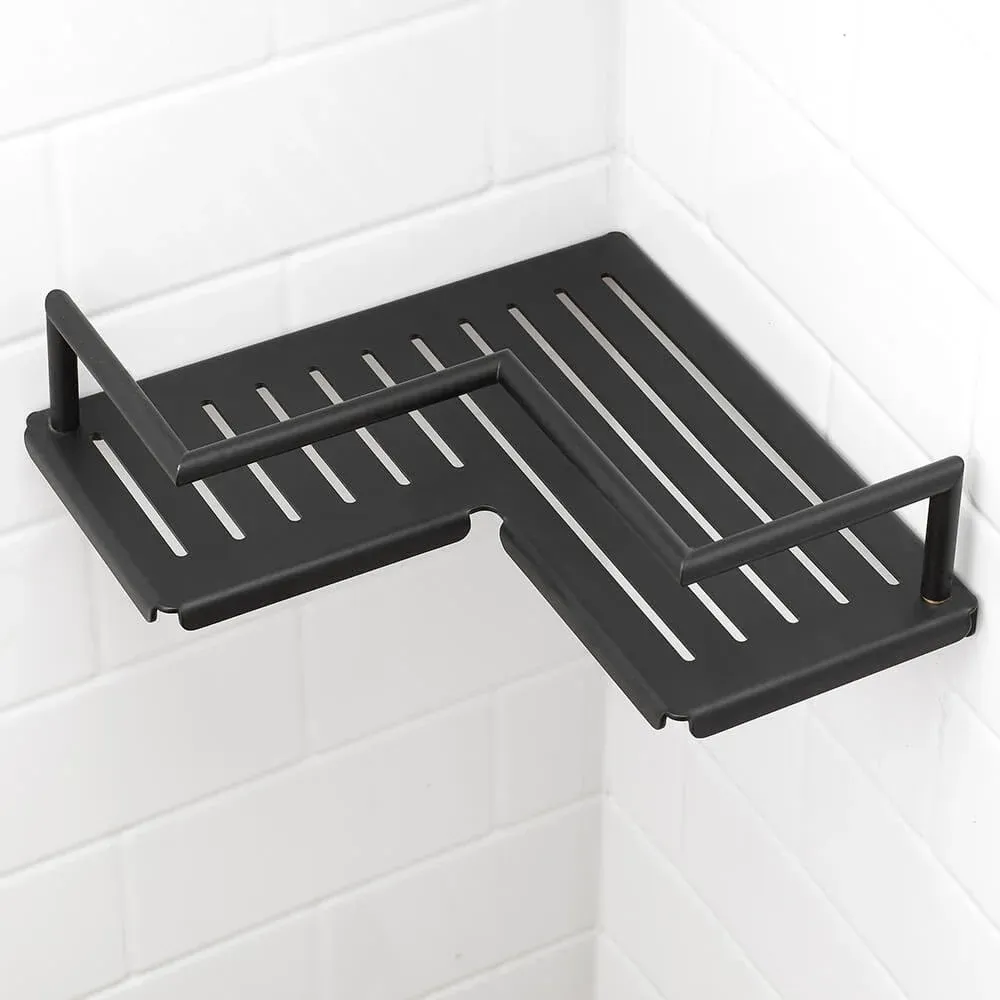 Corner shower shelf with black metal slats and two side rails mounted on white tiled walls