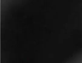 Mostly black image with faint dark gray gradients in the corners